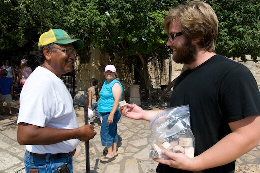 Jacob Goudreault gives away paintings during his San Antonio Alamo performance