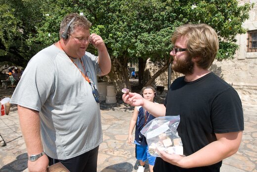 Jacob Goudreault gives away paintings during his San Antonio Alamo performance