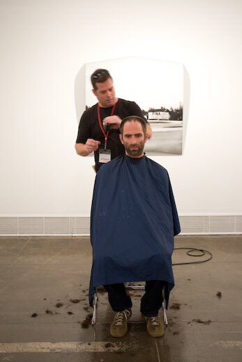 Nate Cassie gives Jonathan Monk a haircut in the Hudson Showroom Nate Cassie gives Jonathan Monk a haircut in the Hudson Showroom